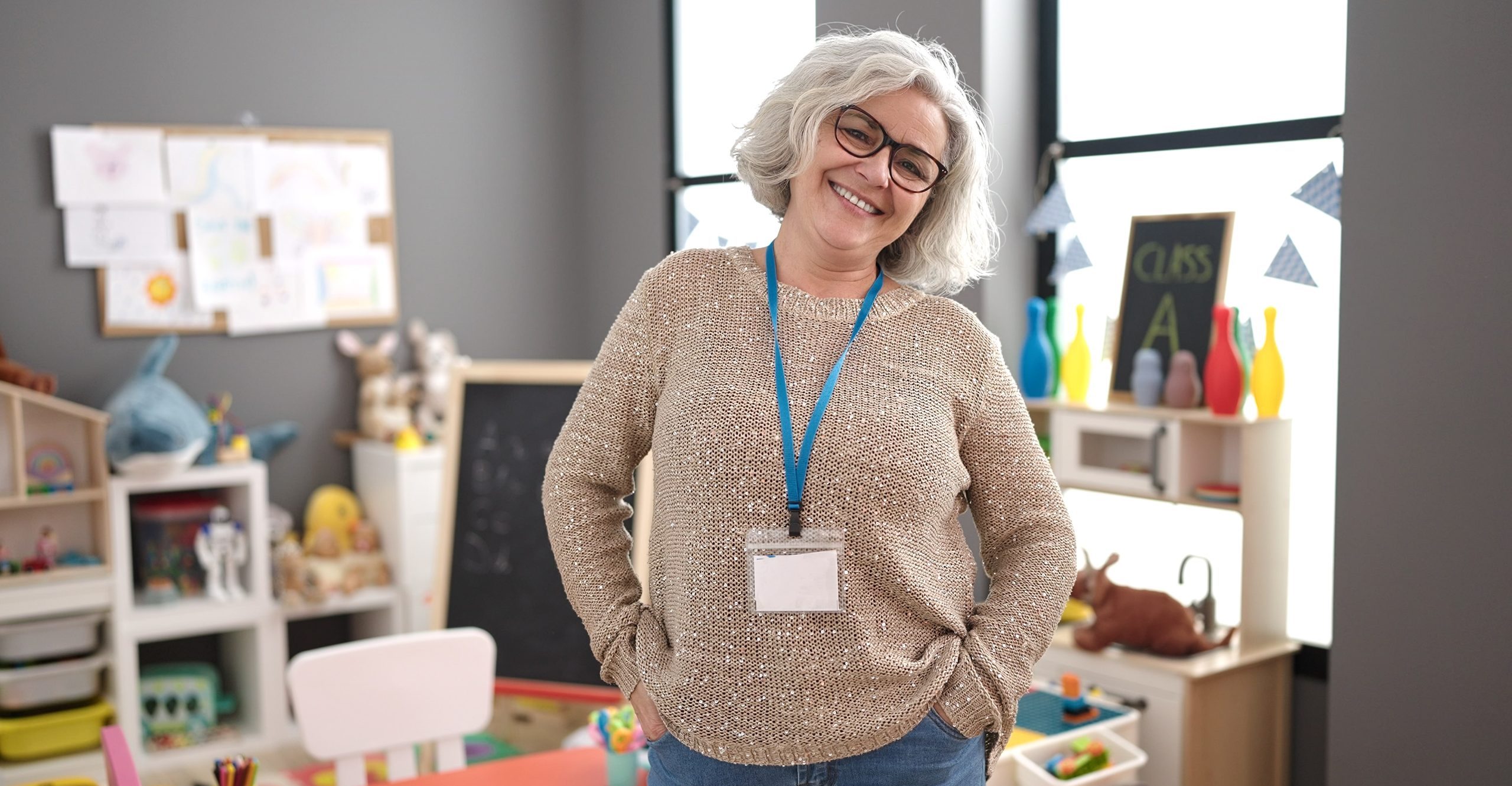 Middle,Age,Woman,With,Grey,Hair,Preschool,Teacher,Smiling,Confident